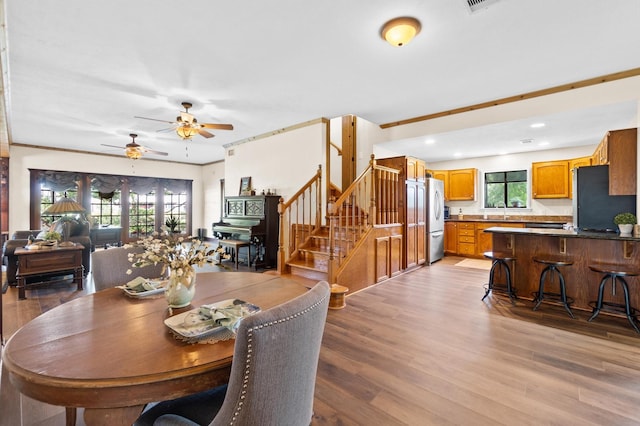 11008 Hillside Dr, Willis, TX 77318 - dining room with light wood-type flooring, a ceiling fan, recessed lighting, and stairway