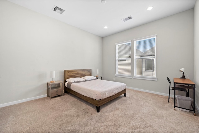 carpeted bedroom featuring recessed lighting, visible vents, and baseboards
