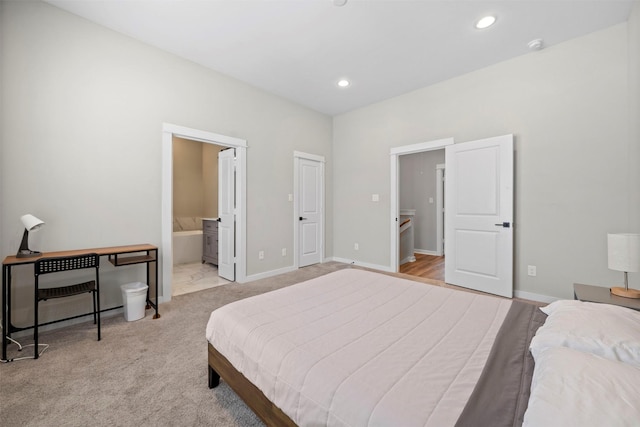 bedroom with baseboards, recessed lighting, and light colored carpet