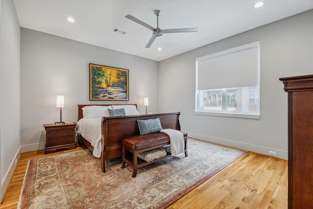 bedroom featuring recessed lighting, visible vents, wood finished floors, and baseboards