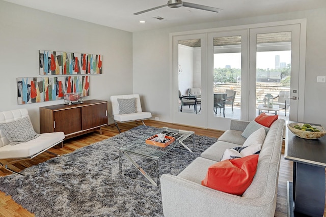 living room with visible vents, wood finished floors, ceiling fan, and recessed lighting