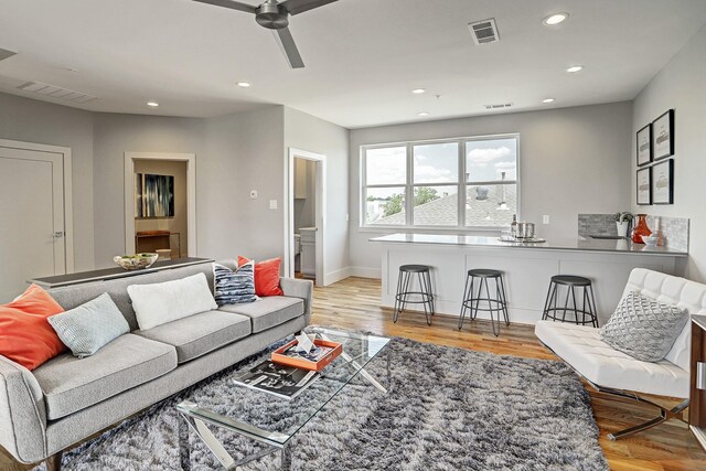 living area with visible vents, ceiling fan, and recessed lighting