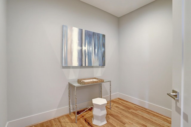 spare room with wood finished floors and baseboards
