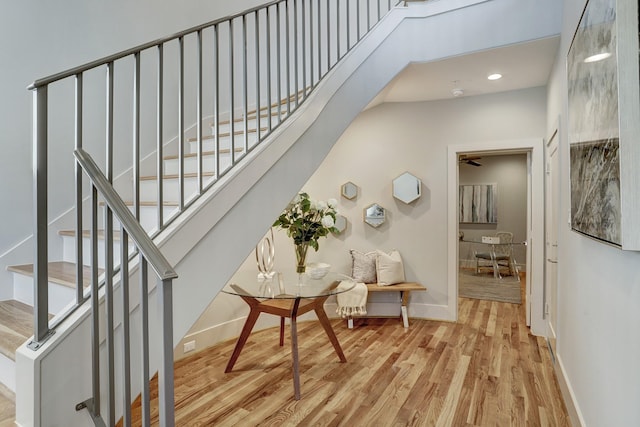 interior space featuring baseboards, recessed lighting, and wood finished floors