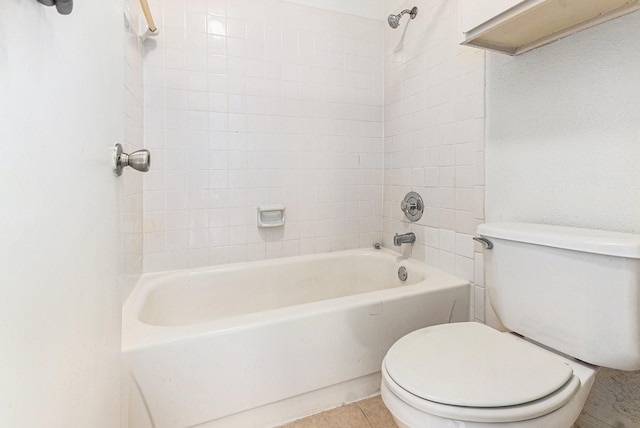 bathroom featuring toilet and shower / bathtub combination