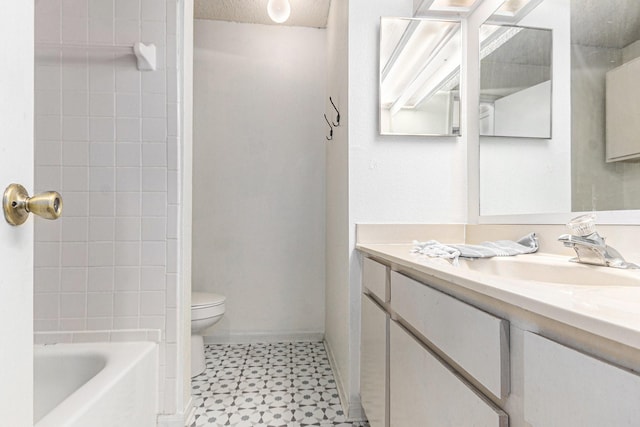 bathroom with tile patterned floors, toilet, and vanity