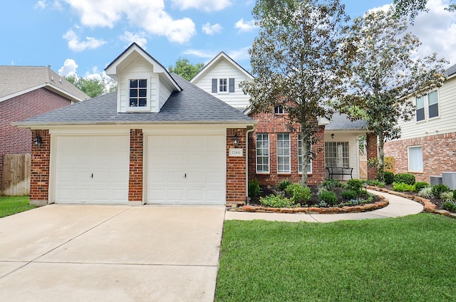 view of front of home featuring driveway, a shingled roof, a front yard, brick siding, and a garage