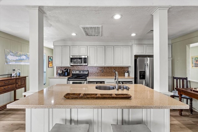4311 Spanish Main, Jamaica Beach, TX 77554 - kitchen featuring appliances with stainless steel finishes, visible vents, light wood-style floors, and a sink