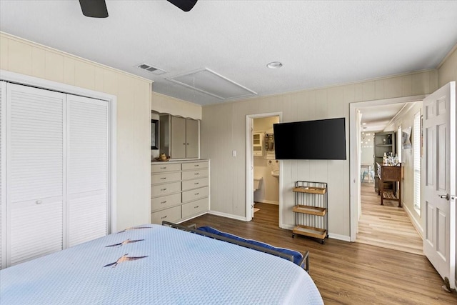 4311 Spanish Main, Jamaica Beach, TX 77554 - bedroom featuring attic access, a closet, visible vents, baseboards, and wood finished floors
