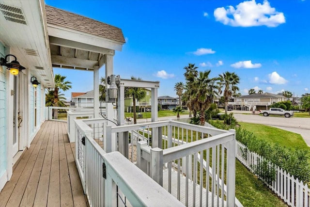 4311 Spanish Main, Jamaica Beach, TX 77554 - wooden deck featuring a residential view and fence