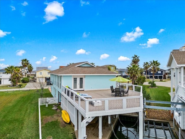 4311 Spanish Main, Jamaica Beach, TX 77554 - rear view of property with french doors, a fenced backyard, a residential view, and a lawn