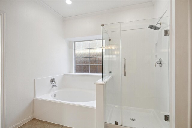 full bathroom with tile patterned floors, a stall shower, ornamental molding, and a bath