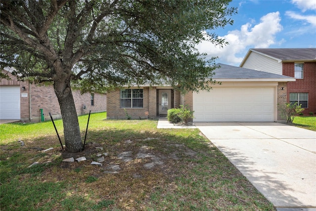 ranch-style home featuring a garage, brick siding, driveway, and a front yard