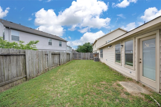 view of yard featuring a fenced backyard and cooling unit