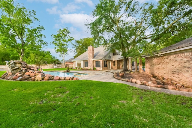 view of yard featuring a fenced in pool and fence