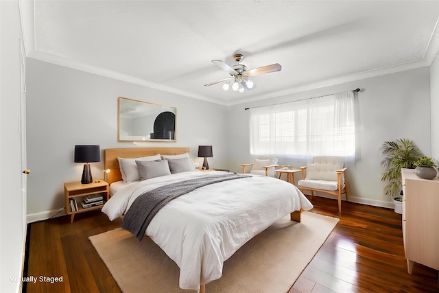 bedroom with crown molding, baseboards, ceiling fan, and wood finished floors