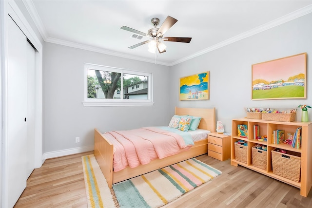 5807 Dumfries Dr, Houston, TX 77096 - bedroom featuring wood finished floors, a closet, and crown molding
