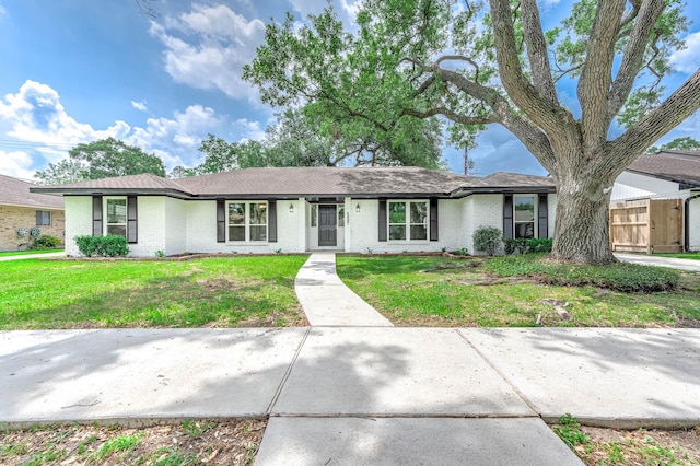 5807 Dumfries Dr, Houston, TX 77096 - single story home featuring a front lawn and brick siding