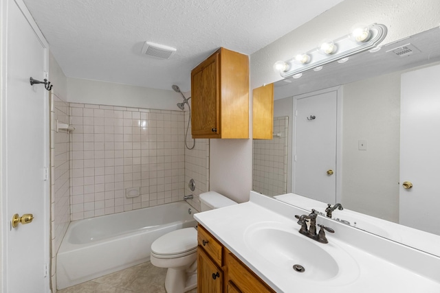full bath with vanity, shower / bath combination, tile patterned floors, toilet, and visible vents