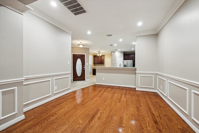 1339 Ella Pl, Houston, TX 77008 - unfurnished room featuring a decorative wall, light wood-type flooring, recessed lighting, a wainscoted wall, and ornamental molding