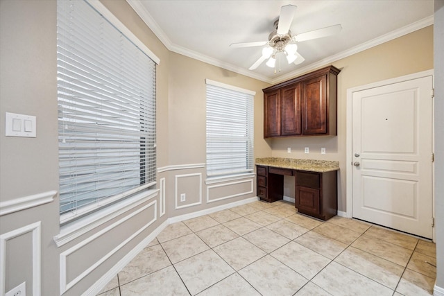 1339 Ella Pl, Houston, TX 77008 - kitchen featuring built in desk, a ceiling fan, crown molding, light tile patterned floors, and light stone countertops