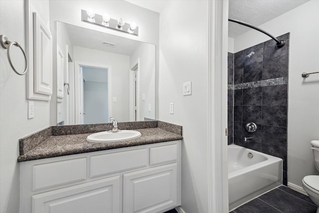 full bath with toilet, tile patterned flooring, vanity, bathing tub / shower combination, and baseboards