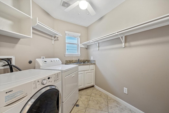 1339 Ella Pl, Houston, TX 77008 - laundry room featuring separate washer and dryer, ceiling fan, cabinet space, and light tile patterned floors
