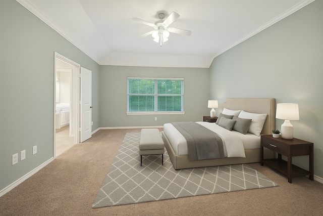 carpeted bedroom with baseboards, crown molding, ceiling fan, vaulted ceiling, and ensuite bath
