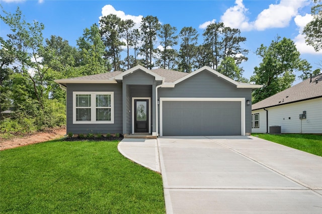 ranch-style home with a front yard, a garage, a shingled roof, central AC unit, and concrete driveway