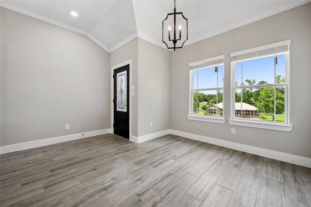 unfurnished room featuring recessed lighting, an inviting chandelier, crown molding, baseboards, and wood finished floors
