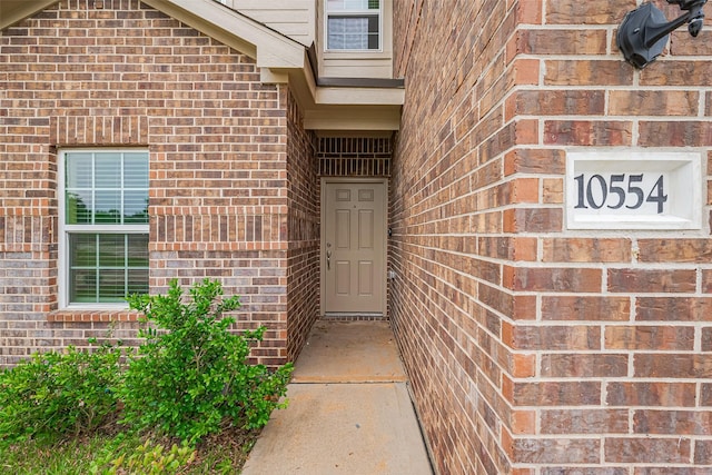entrance to property with brick siding