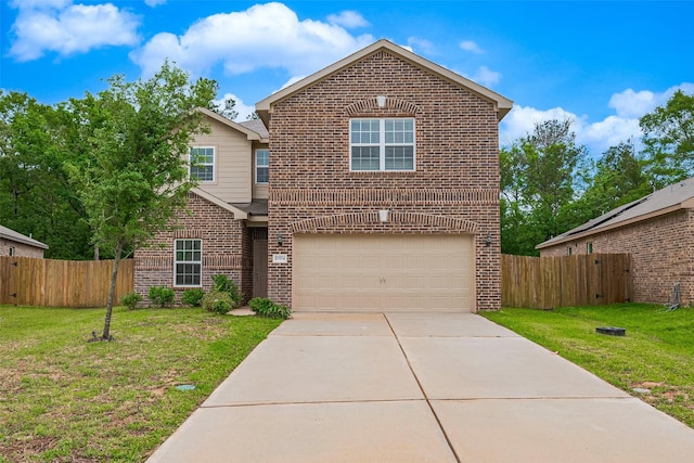 traditional home featuring a front lawn, fence, an attached garage, and brick siding