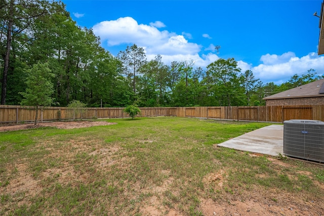 view of yard with central AC, a patio area, and a fenced backyard