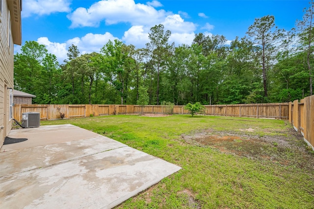 view of yard with central AC unit, a patio area, and a fenced backyard