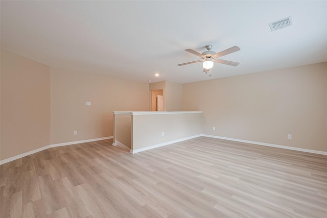 unfurnished room featuring visible vents, ceiling fan, baseboards, light wood-type flooring, and recessed lighting
