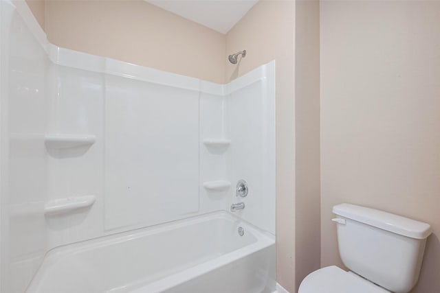 full bath featuring toilet and baseboards