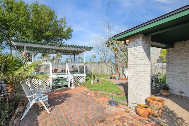 24 Clara Barton Ln, Galveston, TX 77551 - view of patio with a pergola and a fenced backyard