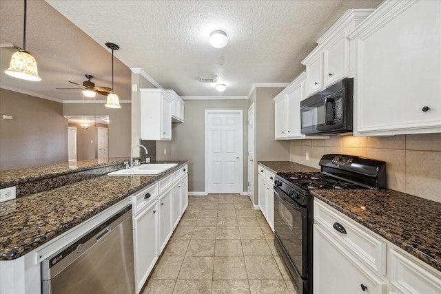 24 Clara Barton Ln, Galveston, TX 77551 - kitchen with black appliances, a sink, a ceiling fan, a textured ceiling, and white cabinetry