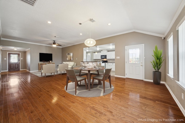 24 Clara Barton Ln, Galveston, TX 77551 - dining area with a ceiling fan, plenty of natural light, light wood-style flooring, ornamental molding, and baseboards