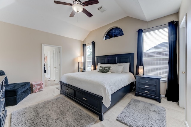 bedroom featuring light colored carpet, visible vents, ceiling fan, and vaulted ceiling