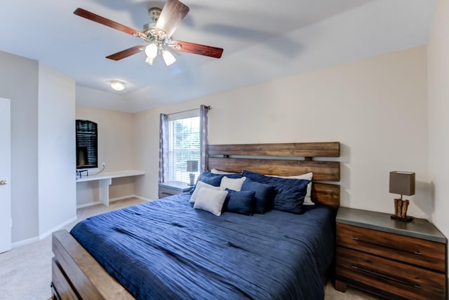 carpeted bedroom with baseboards and a ceiling fan