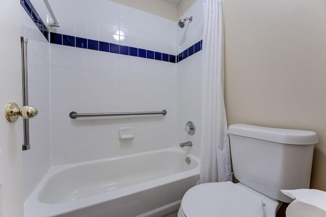 bathroom featuring shower / bathtub combination with curtain and toilet