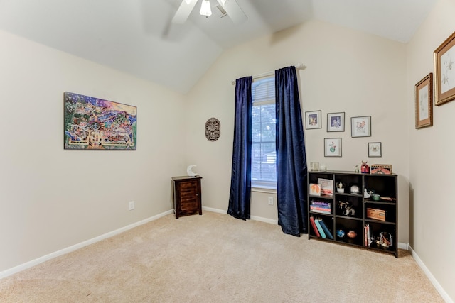 interior space with a ceiling fan, carpet floors, and lofted ceiling