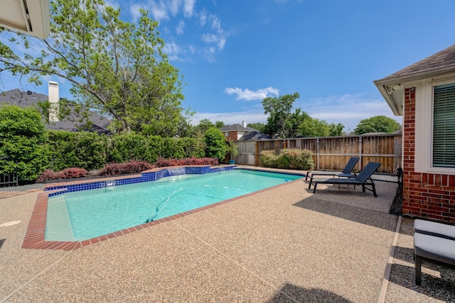 view of swimming pool featuring a fenced in pool, a patio area, and a fenced backyard