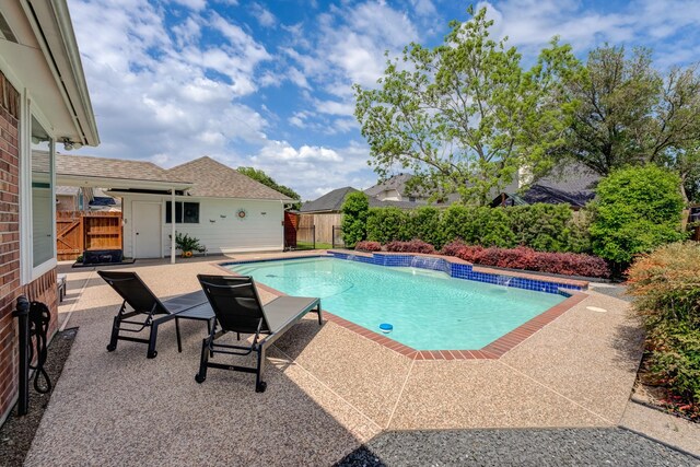 view of swimming pool featuring fence, a patio area, and a fenced in pool