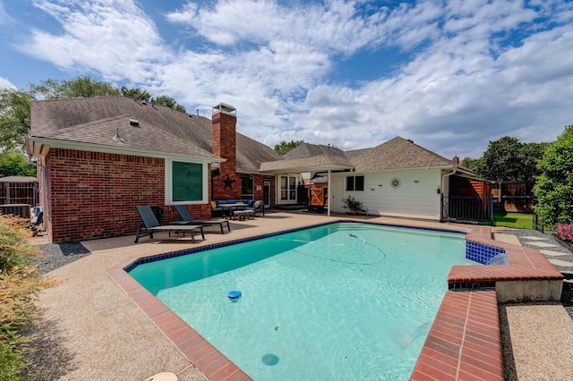 view of pool with fence, a patio area, and a fenced in pool