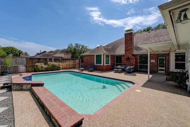 view of swimming pool featuring a fenced backyard, a patio, an outdoor hangout area, and a fenced in pool