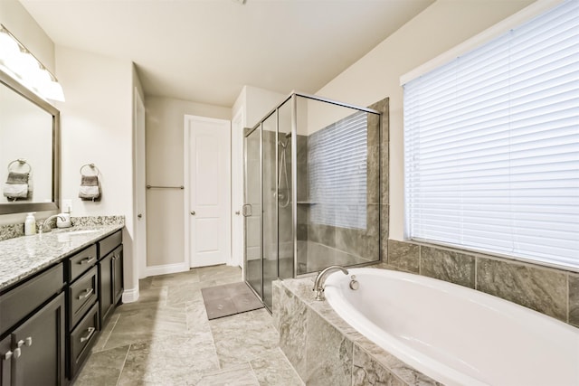 5722 Willow Park Terrace Ln, Porter, TX 77365 - full bath with vanity, a stall shower, a garden tub, and baseboards