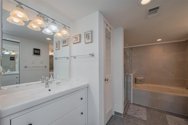 full bath with visible vents, a closet, vanity, a washtub, and a stall shower