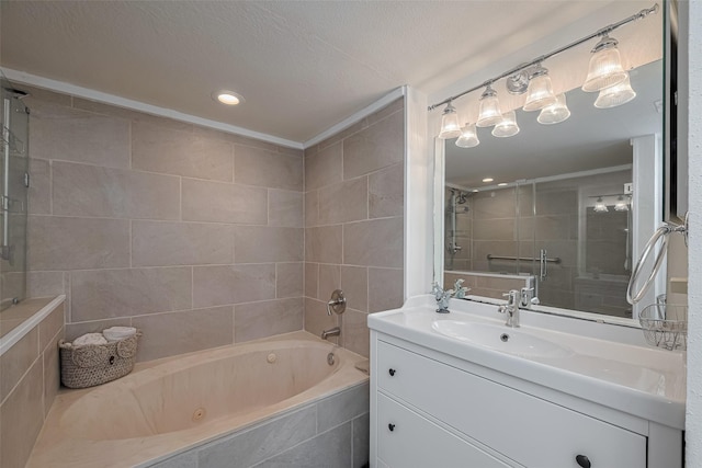 bathroom with recessed lighting, a tub with jets, tiled shower, and vanity